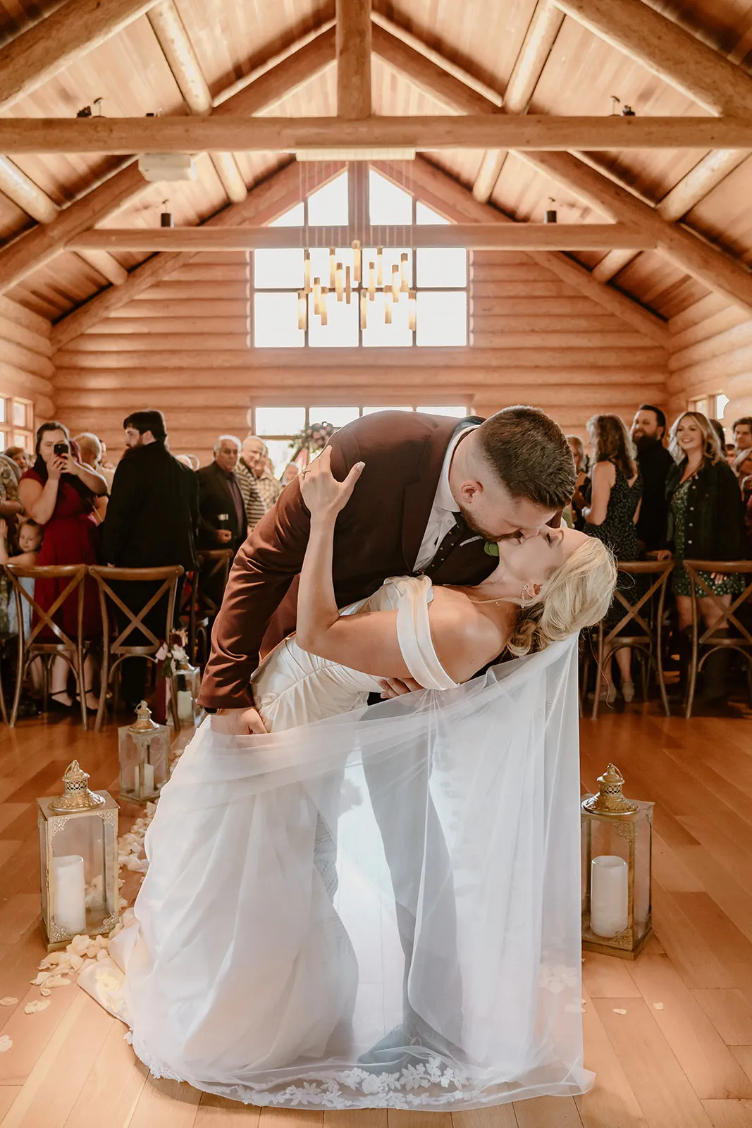 Bride and groom kissing at their wedding reception